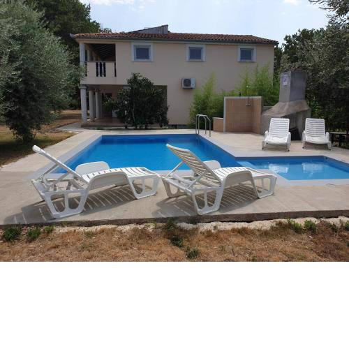 Apartment in holiday home with private pool