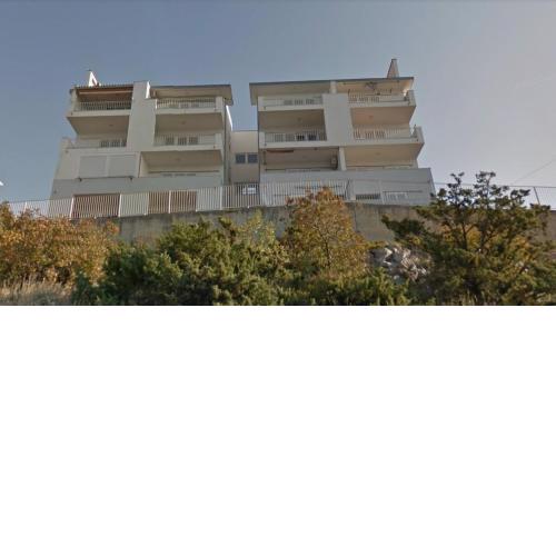 Apartments with a parking space Senj - 15236